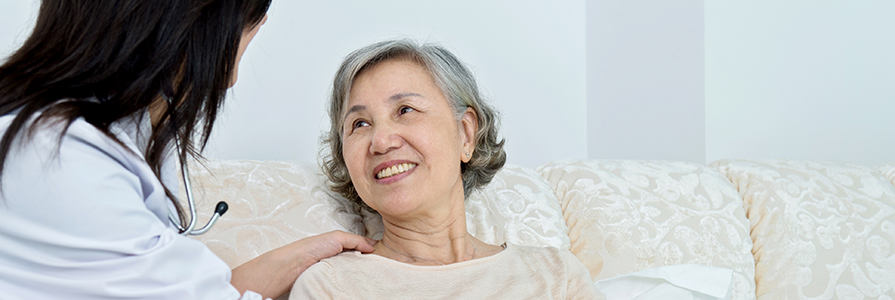 A doctor talks to her patient