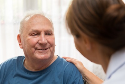 A man talking to his nurse