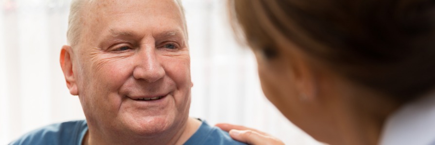 A man talking to his nurse