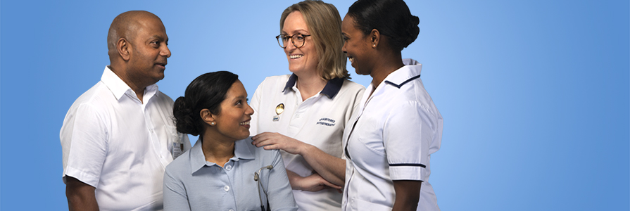 A group of NHS staff laughing together